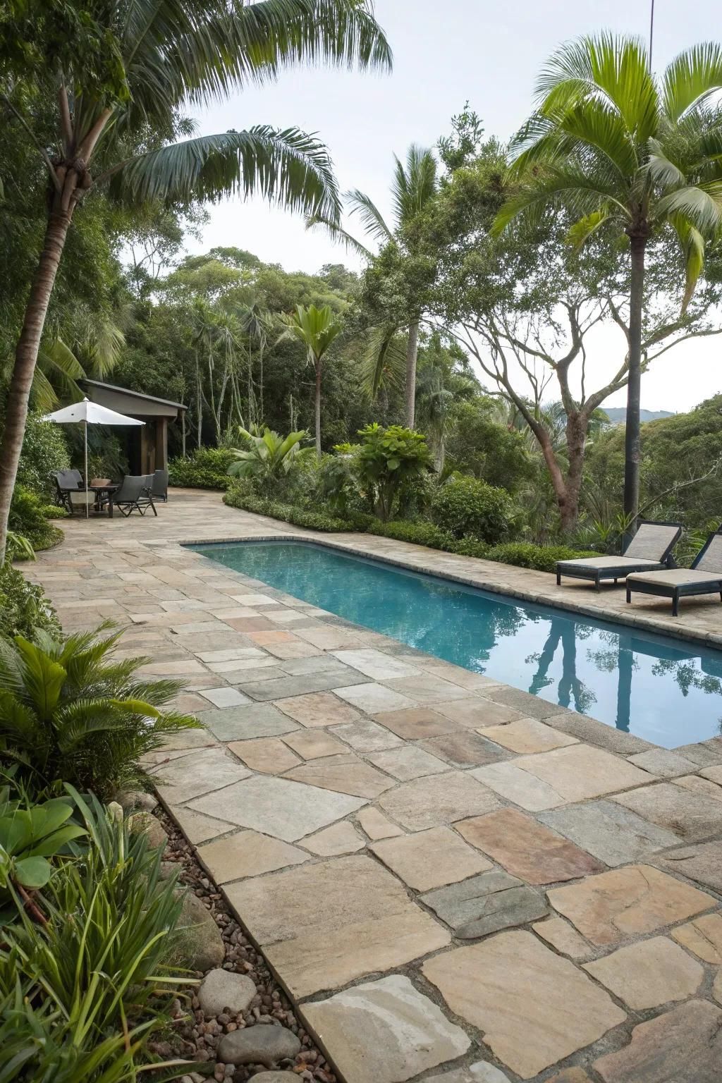 Natural stones add texture and elegance to the poolside.