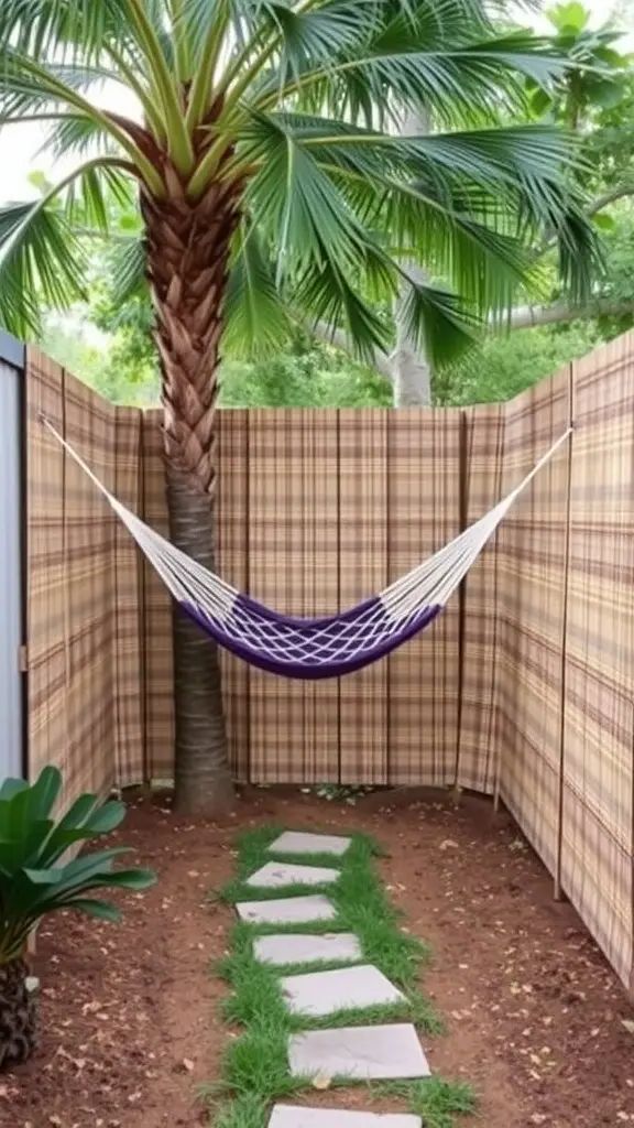 A backyard nook with reed panel fencing, a hammock, and a palm tree.