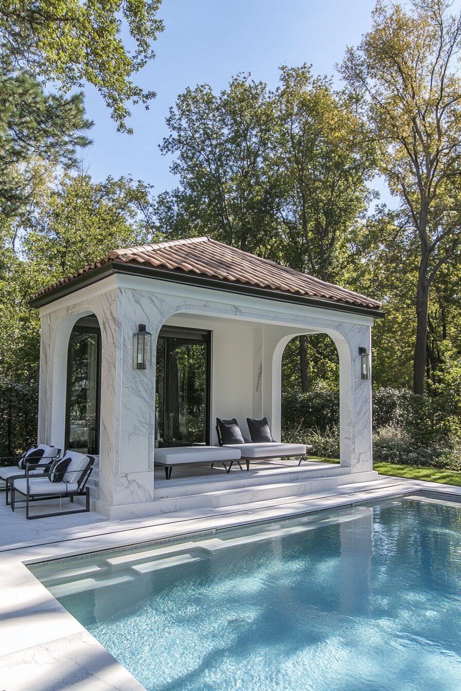 Pool house design. White marble changing cabana by a panoramic pool with an indoor-outdoor shower.