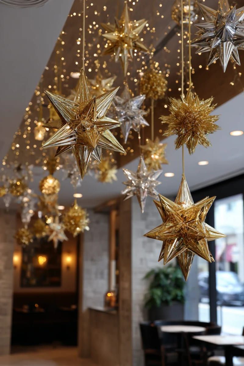 gold and silver tinsel stars hanging from the ceiling for a dreamy glow 1
