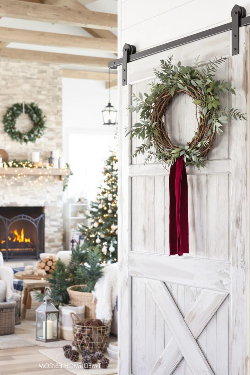 woven wreath with fresh greenery and a single velvet ribbon 1