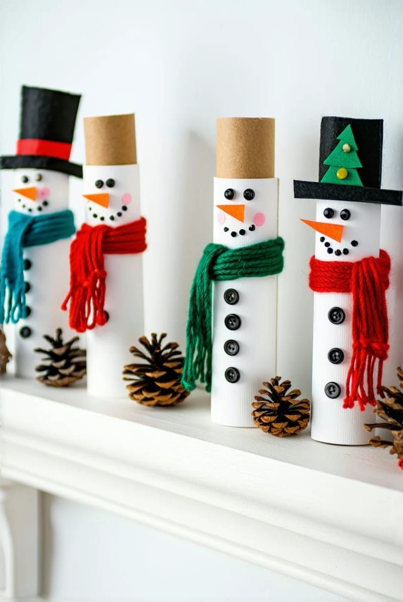 paper roll snowmen with button eyes and yarn scarves for mantel 1