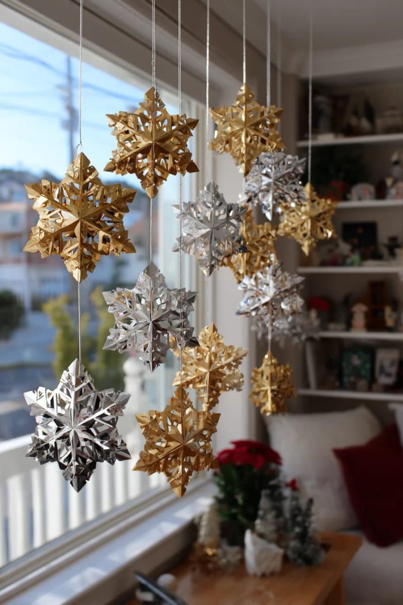 hanging wooden snowflakes painted in metallic gold and silver 1