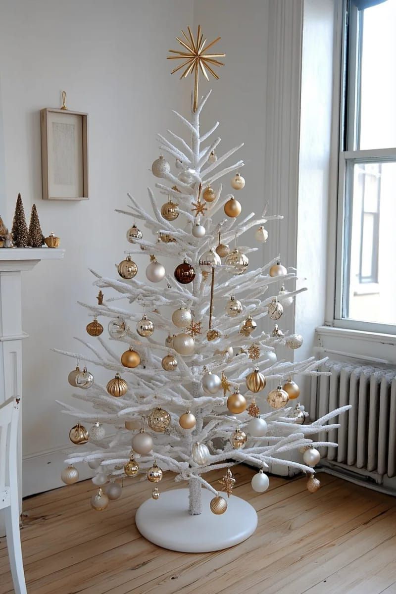 minimalist white and gold tree with delicate glass ornaments 1