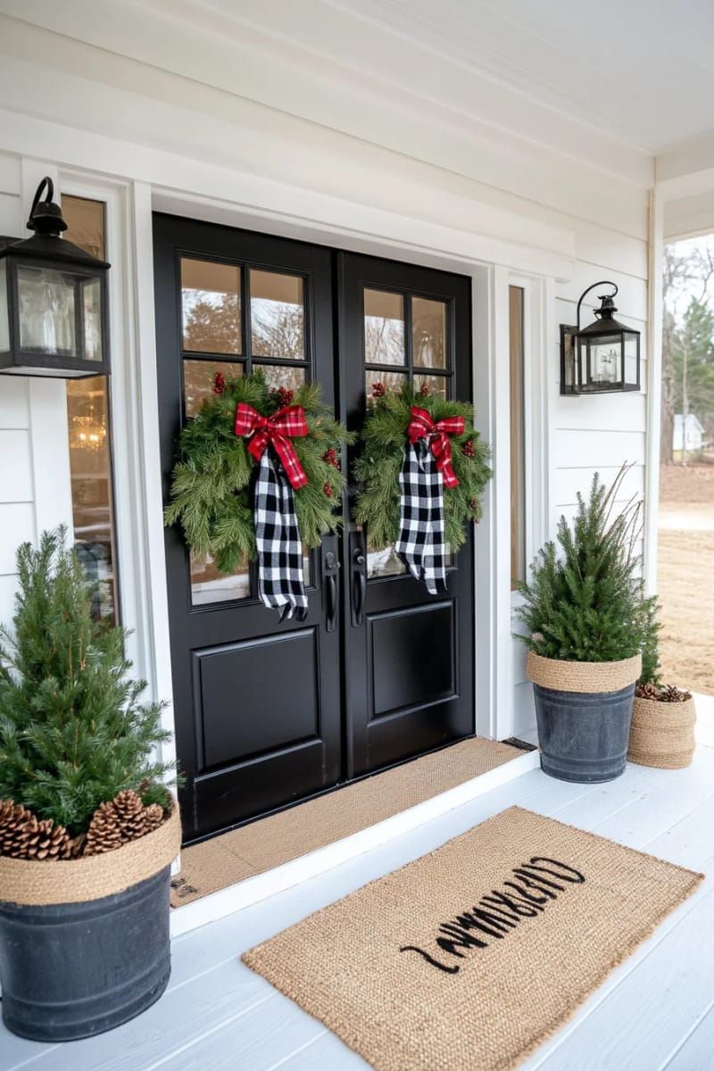 black and white checkered bows tied to greenery on entry doors 1
