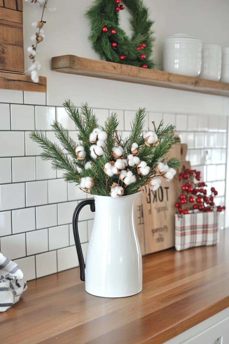 milk jug vase with fresh cedar and cotton stems for kitchen decor 1