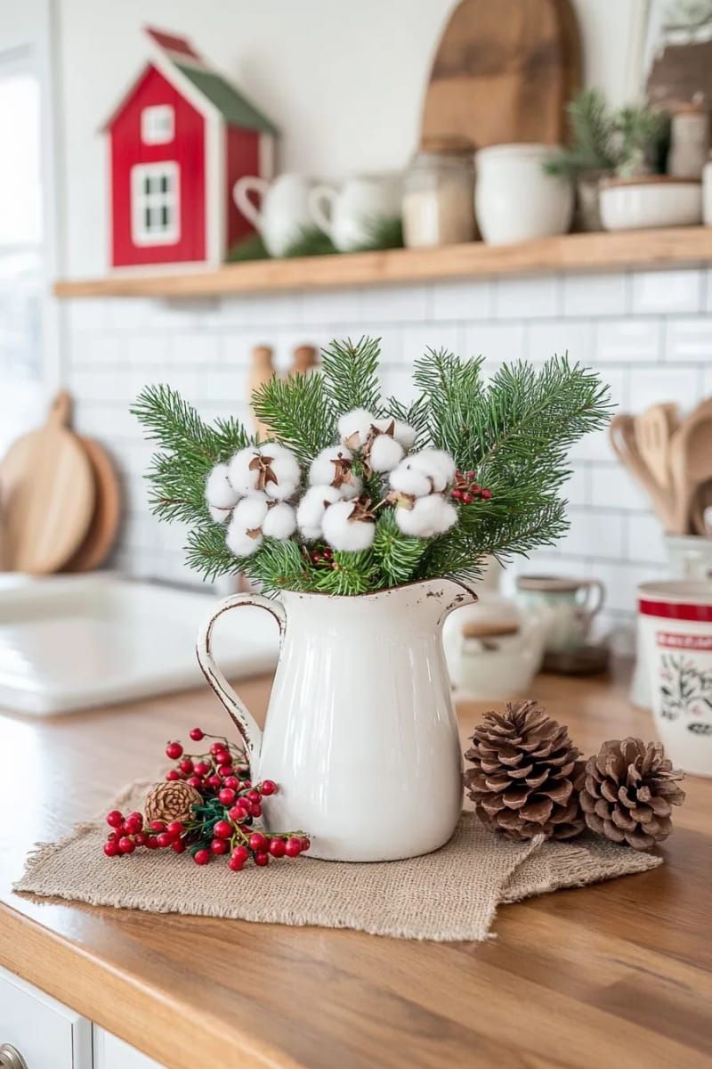 milk jug vase with fresh cedar and cotton stems for kitchen decor 1