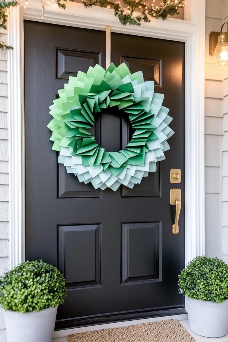 sleek modern wreath made of folded paper christmas trees in ombre colors 1