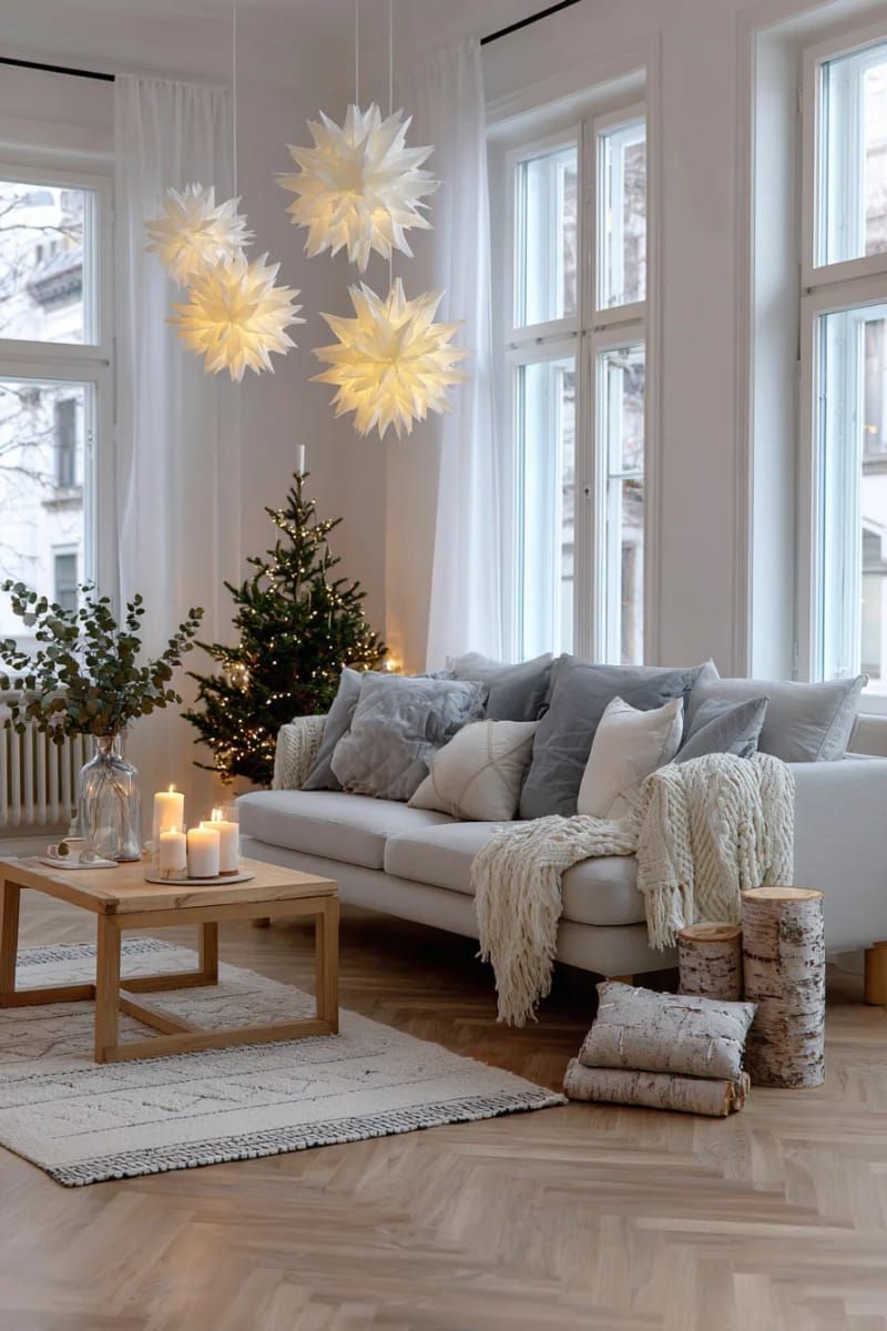 scandinavian-inspired paper star lanterns hanging in staggered heights 1