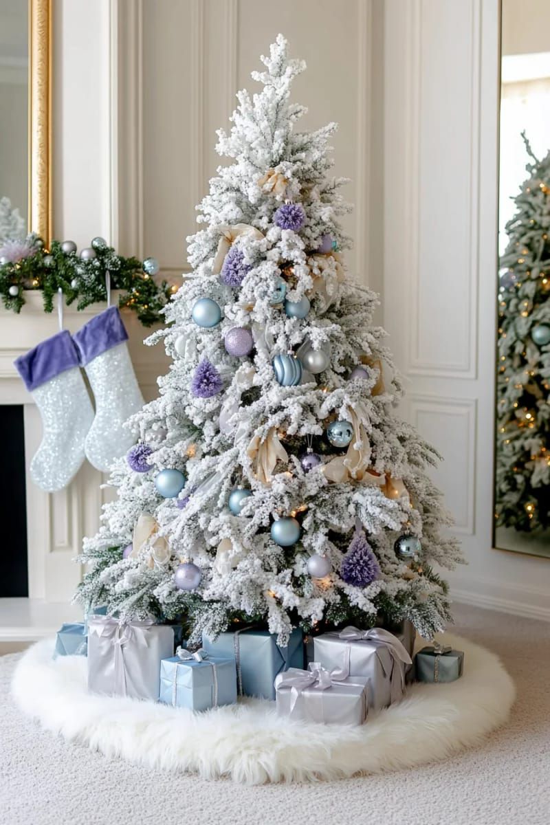 elegant flocked tree with icy blue, lavender, and silver ornaments 1