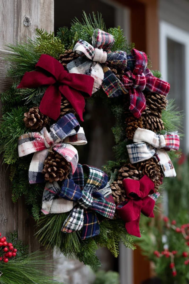 old flannel shirt christmas wreath with pinecones and plaid bows 1