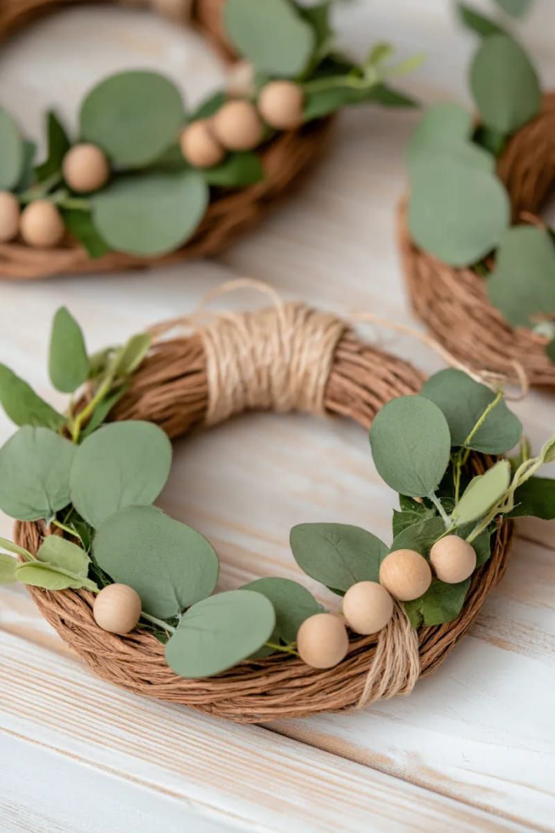 mini rustic wreaths with eucalyptus and wooden beads for natural vibes 1