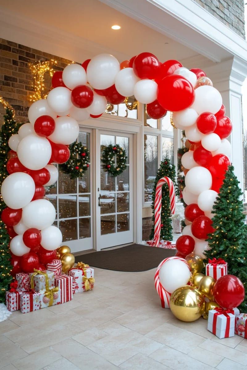 candy cane archway made from twisted red and white balloons for the entry 1