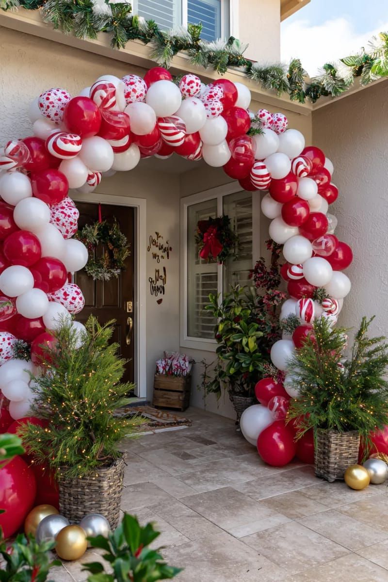candy cane archway made from twisted red and white balloons for the entry 1