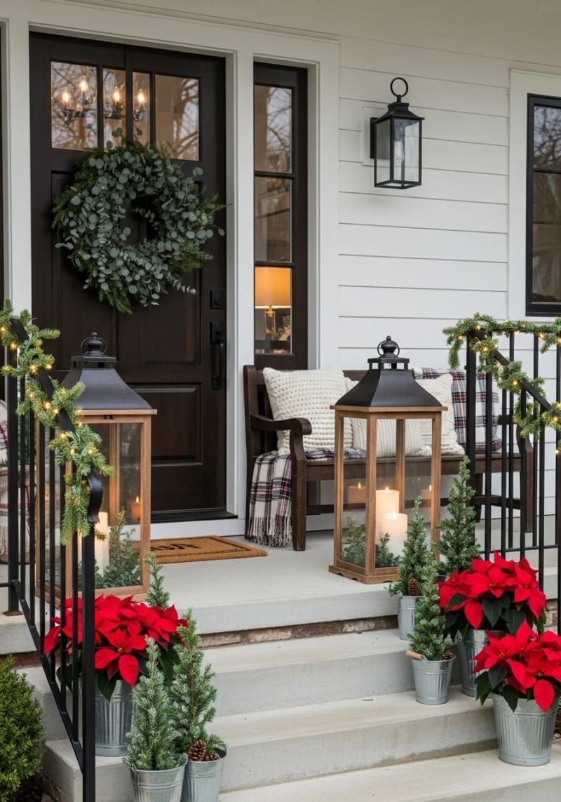 oversized rustic lanterns with pillar candles and eucalyptus sprigs beside the door 1